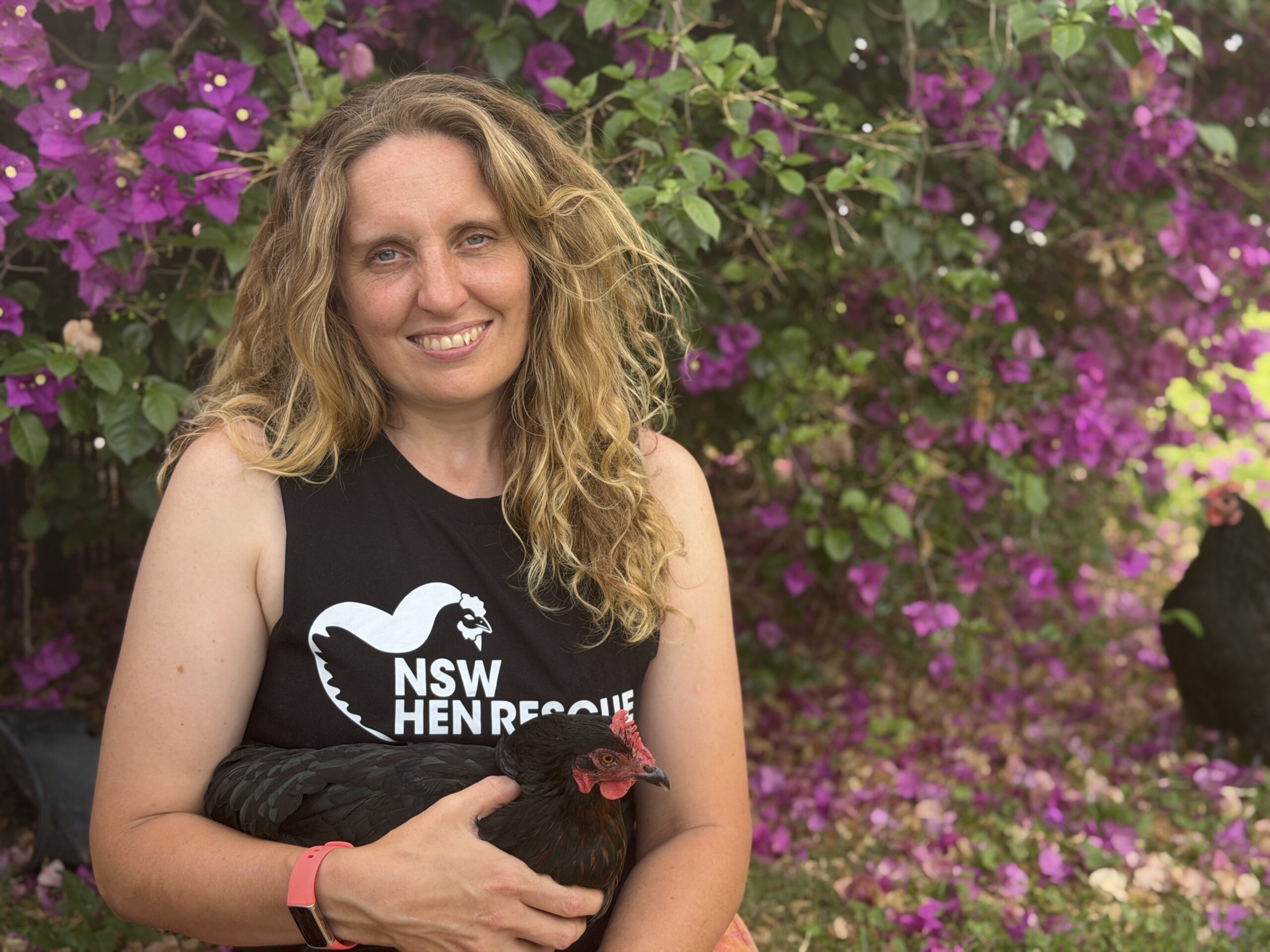 Catherine Kelaher with a rescued hen